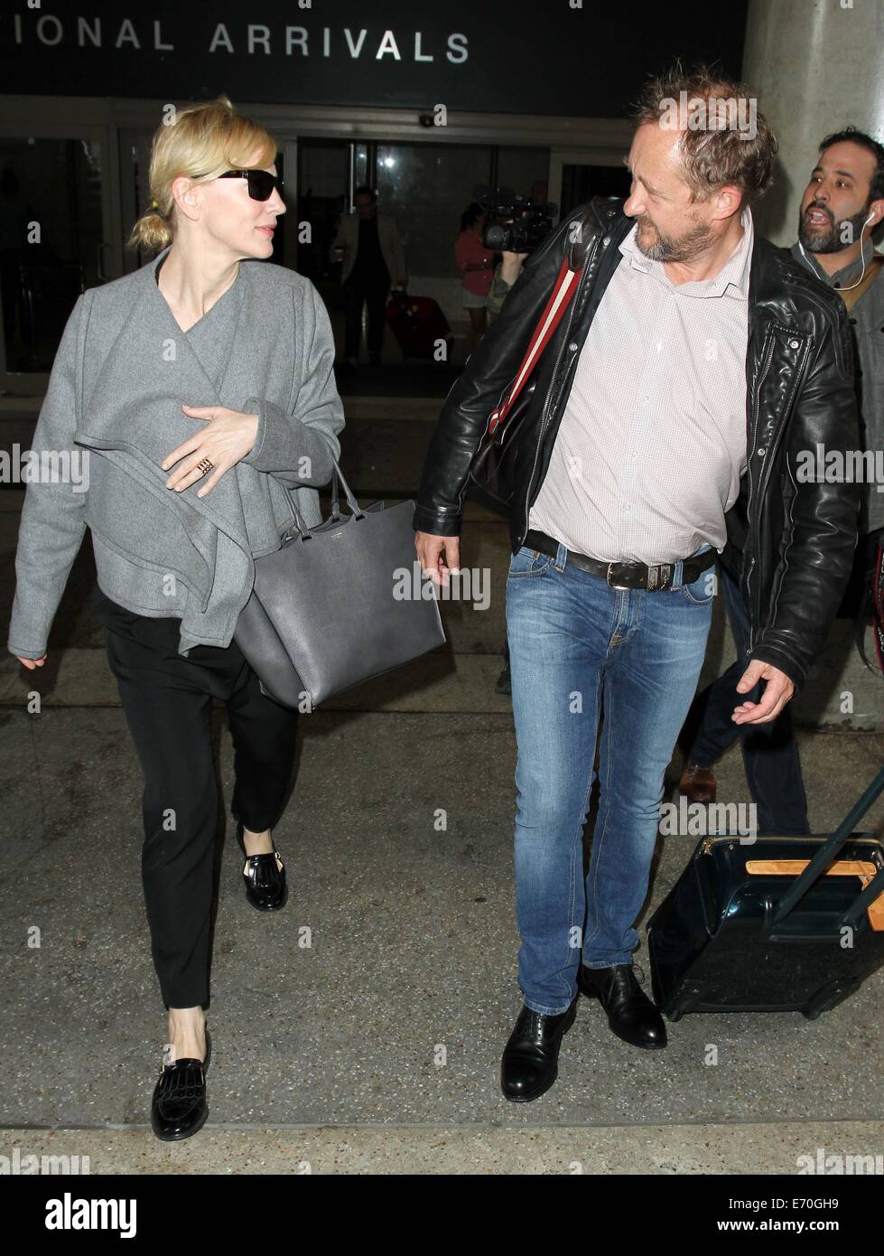 Cate Blanchett arrives at Los Angeles International Airport (LAX) with her  husband Andrew Upton. Blanchett is nominated for Best Actress in the film  'Blue Jasmine' at the 86th Oscars on Sunday (02Mar14)., image size:979x1390