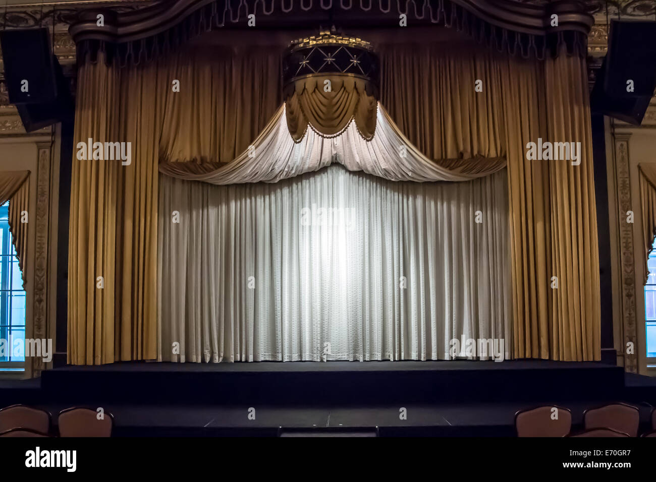 The curtain is drawn on a stage in a ballroom Stock Photo