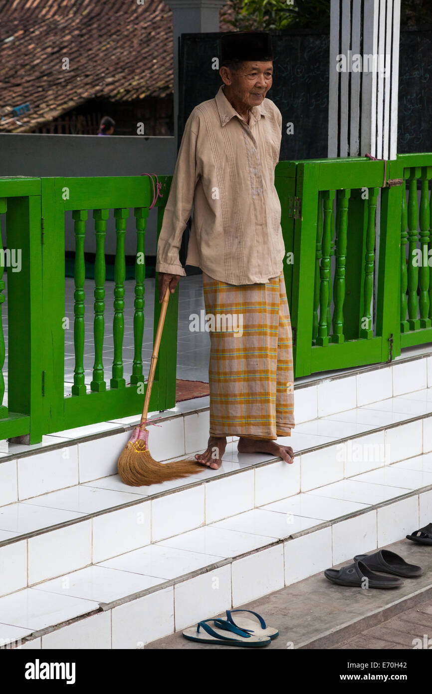 Borobudur, Java, Indonesia.  Caretaker at Village Mosque.  Javanese-style Spindles in the Railing. Stock Photo