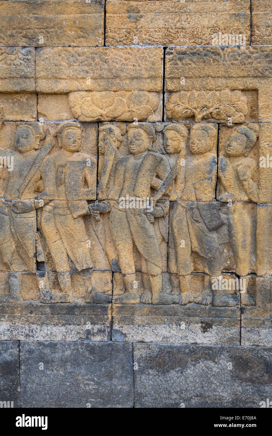 Borobudur, Java, Indonesia.  Bas-relief Stone Carving Showing Scenes from the Life of the Buddha. Stock Photo
