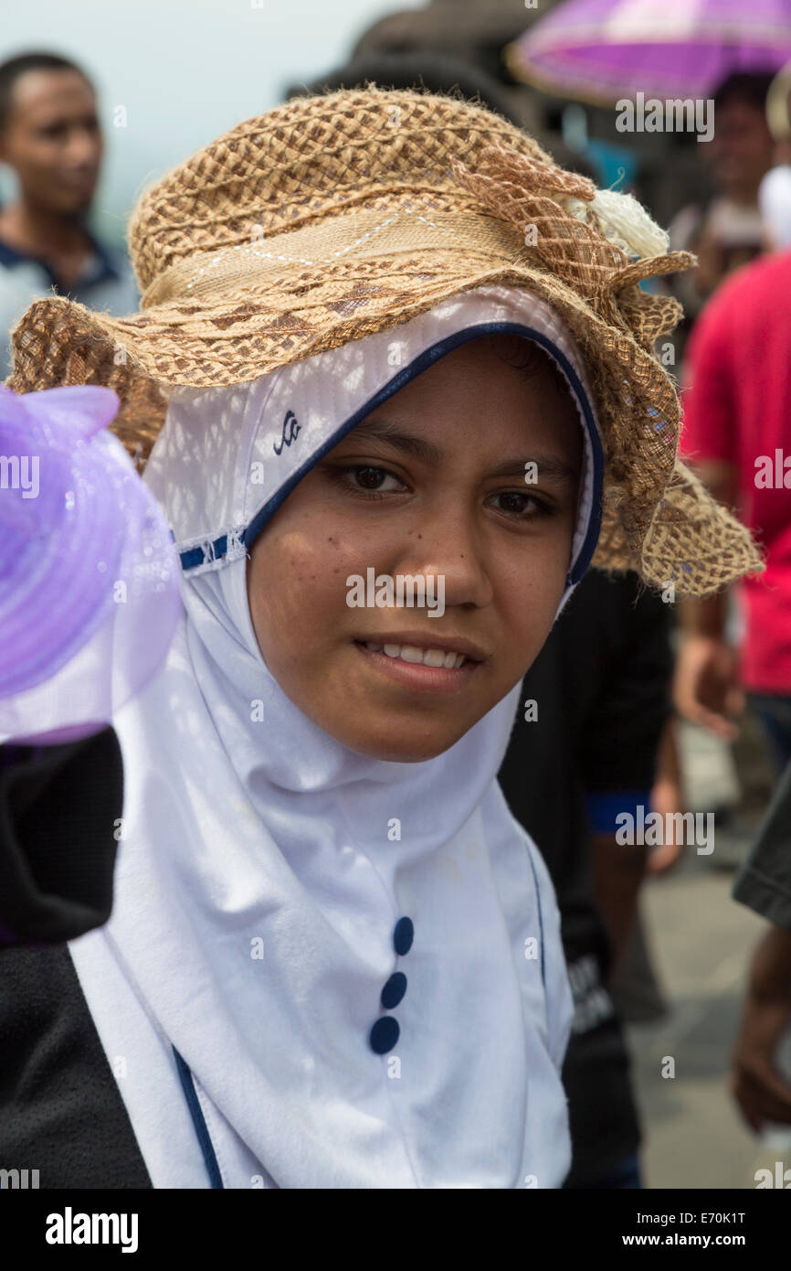 Borobudur, Java, Indonesia.  Young Indonesian Girl Visiting the Temple. Stock Photo