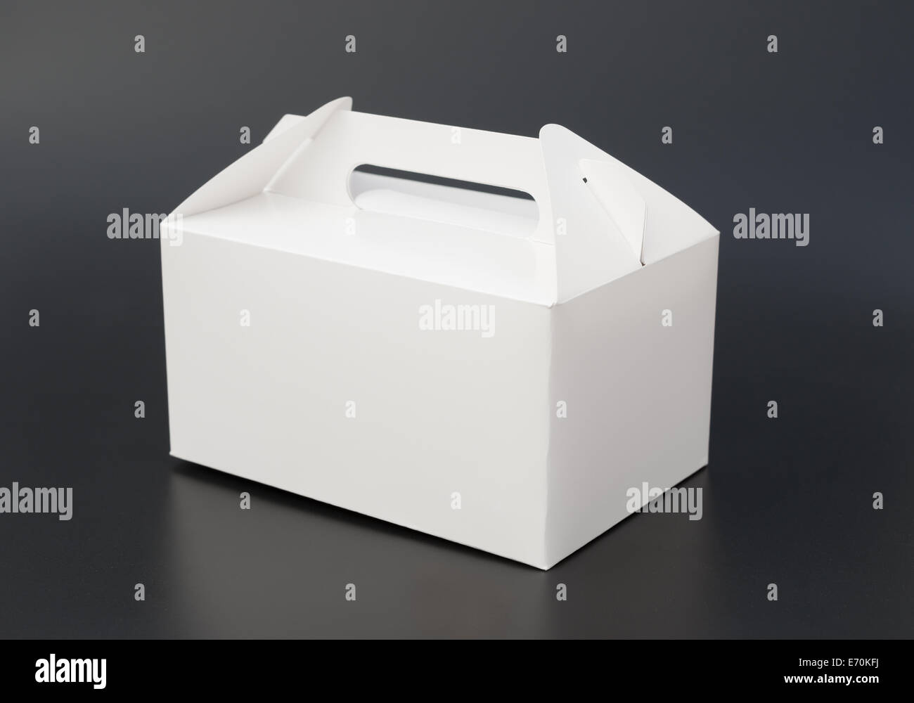 hand carry white box on black background Stock Photo