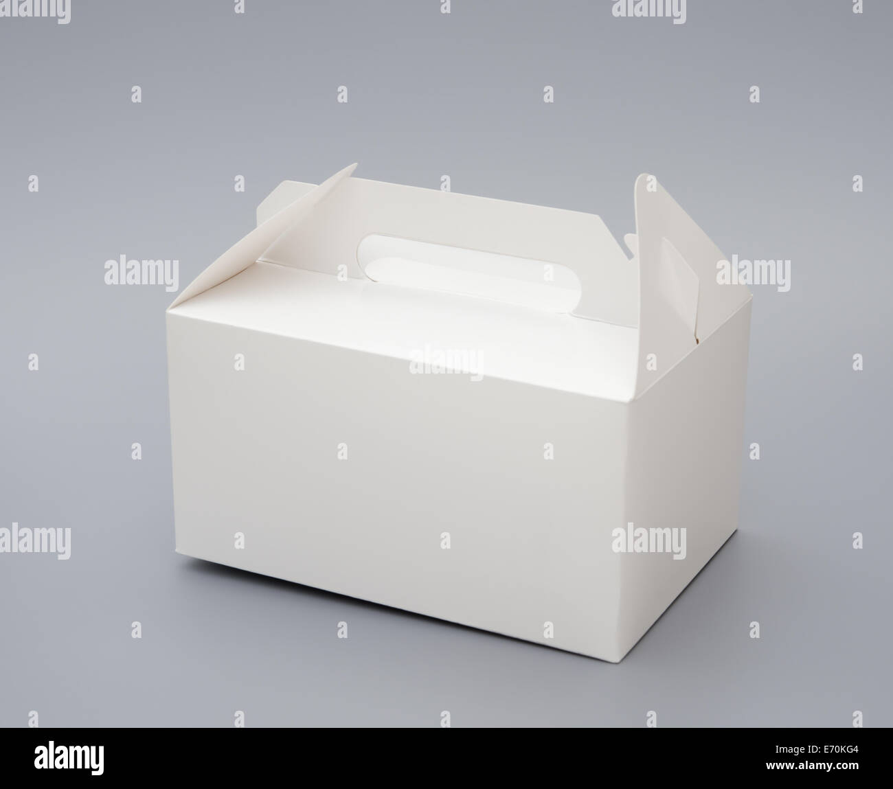 hand carry white box on grey background Stock Photo