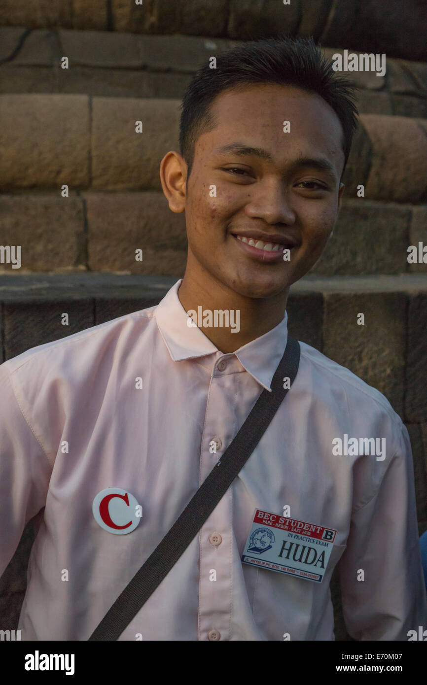Borobudur, Java, Indonesia.  Young Indonesian Student, Practicing English while Visiting the Temple. Stock Photo