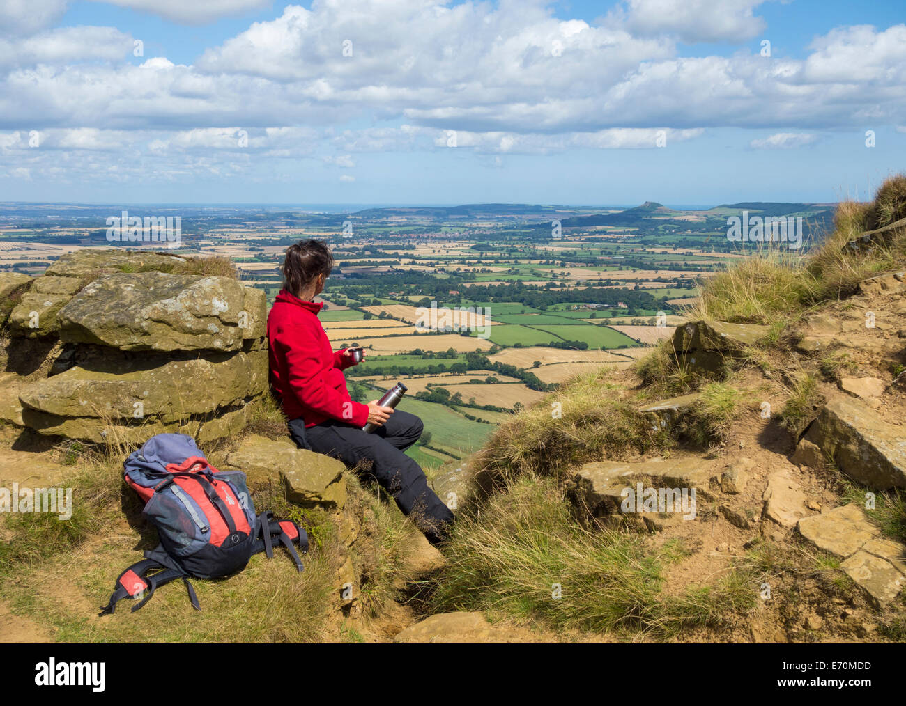Female hiker, walker on The Wainstones on The Cleveland Way National Trail footpath. North York Moors National Park. North Yorkshire, England. UK Stock Photo