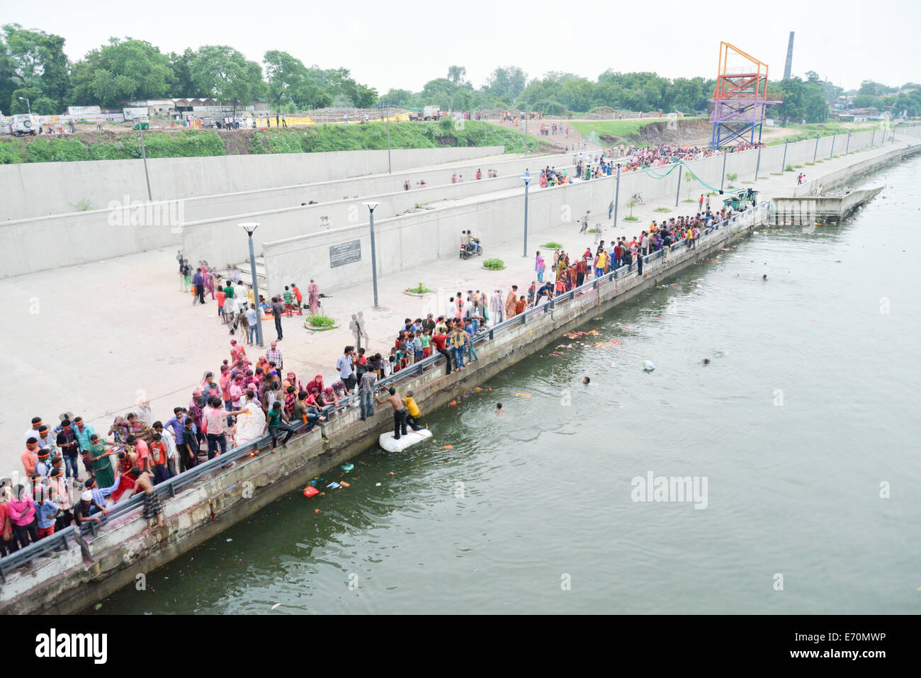Ahmedabad, Gujarat, India. 2nd Sep, 2014. People immersing an idol of