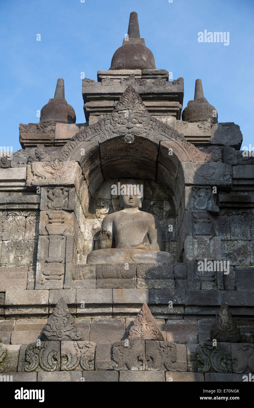 Borobudur, Java, Indonesia.  Buddha Statue Showing the Vitarka Mudra, the gesture used when giving a lecture or a speech. Stock Photo