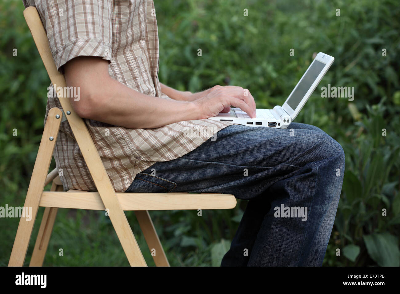 Man sitting hand folding hi-res stock photography and images - Alamy