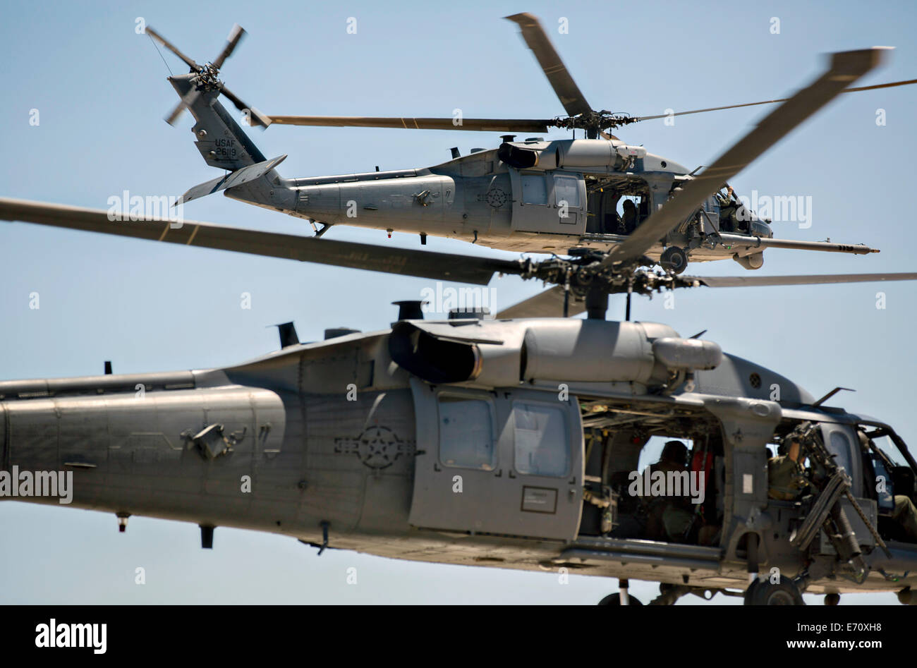 US Air Force UH-60 helicopters with the 159th Rescue Squadron fly training missions during Large Scale Exercise at Camp Wilson, Marine Corps Air Ground Combat Center August 6, 2014 in Twentynine Palms, California. Stock Photo