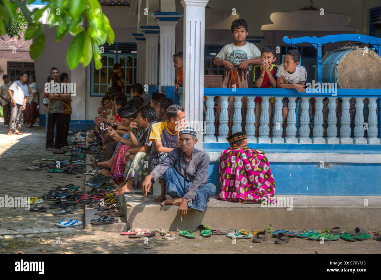 Borobudur, Java, Indonesia.  Young Men Waiting for Noon Prayers at a Neighborhood Mosque. Stock Photo