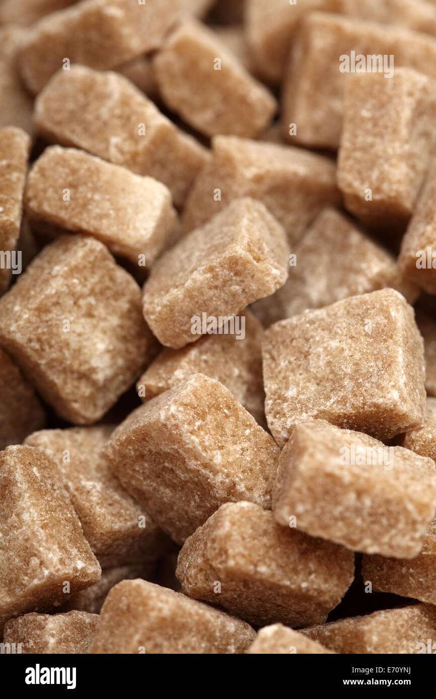 Cane sugar lumps. Closeup. Stock Photo