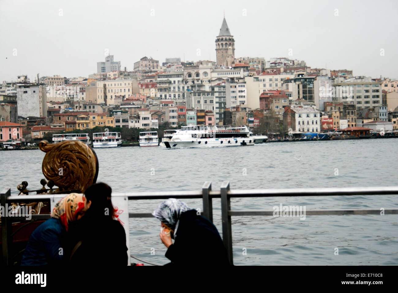 muslim women eating in Istanbul harbor Stock Photo