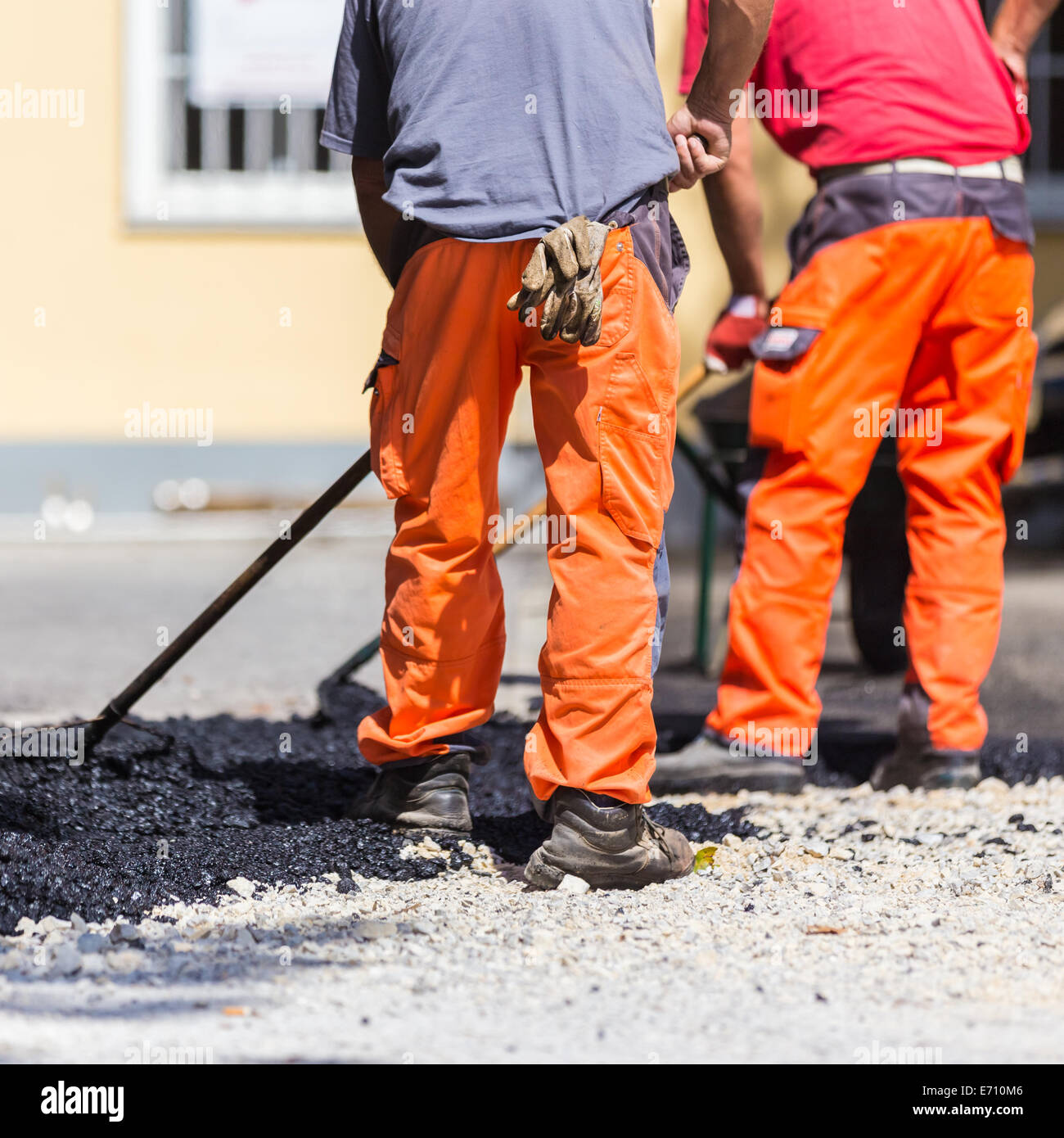 Asphalt surfacing manual labor Stock Photo Alamy