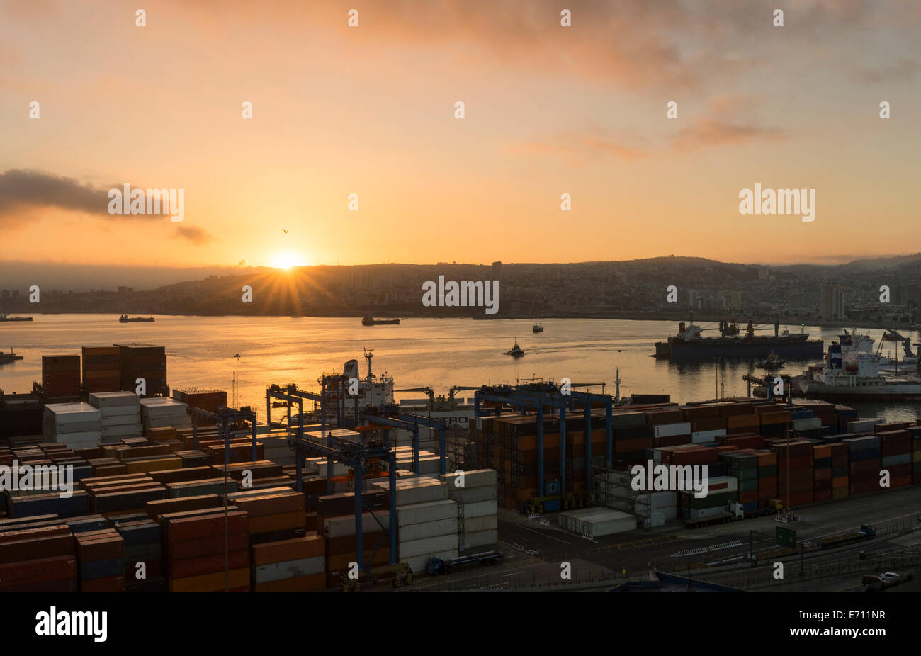View of city and ports at dawn from Paseo 21 de Mayo, Cerro Playa Ancha, Valparaiso, Central Coast, Chile Stock Photo