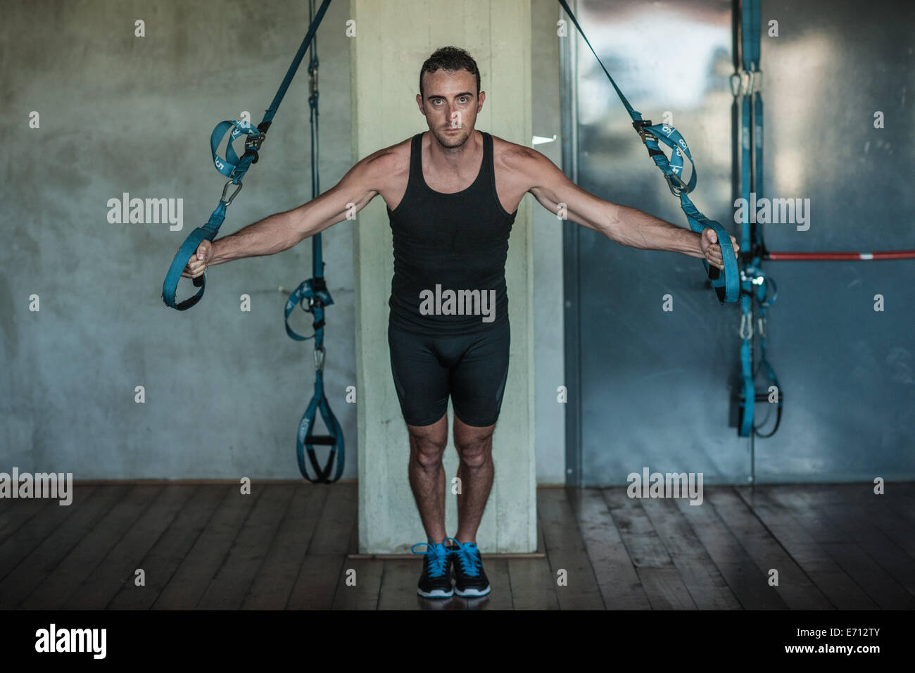 Mid adult man weight training Stock Photo - Alamy