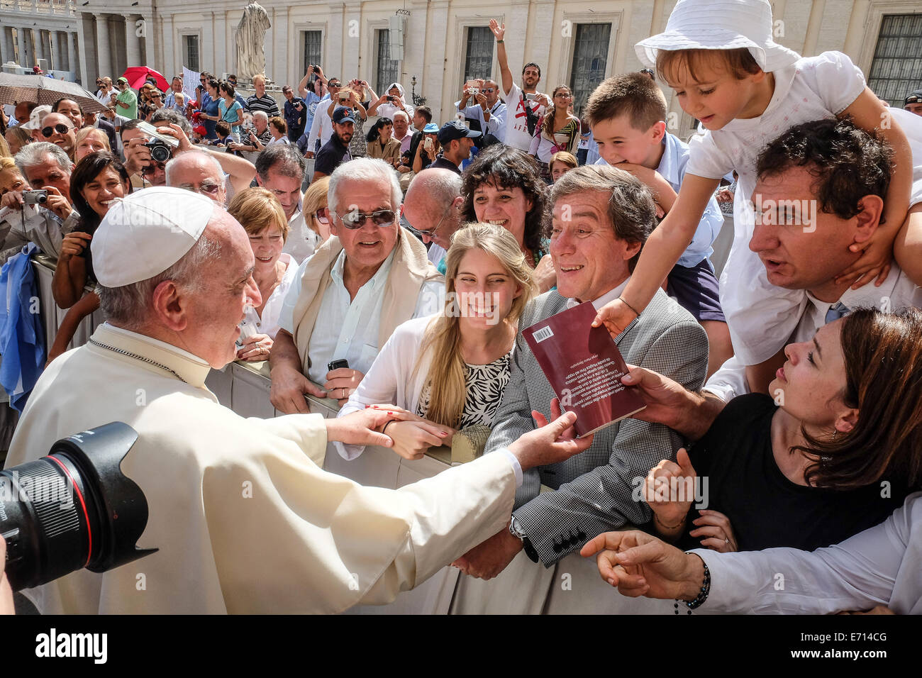 St. Peter's Square, Vatican.  3rd Sep, 2014. Pope Francis greet father Padre Carlos “Charly” Olivero while a baby gives him a copy of the book 'Padri dalla Fine del Mondo' - General Audience of Pope Francis, 03 September 2014 Credit:  Realy Easy Star/Alamy Live News Stock Photo