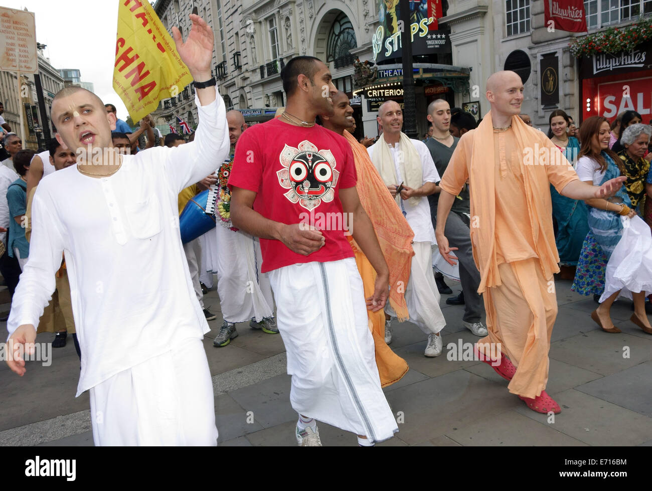 Hare Krishna followers performing in Piccadilly Circus, London Stock Photo