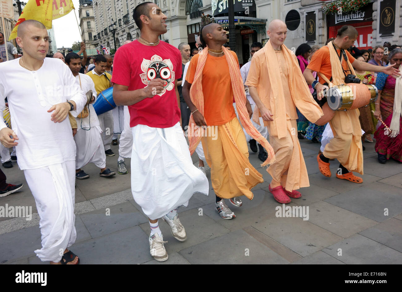 Hare Krishna followers performing in Piccadilly Circus, London Stock Photo