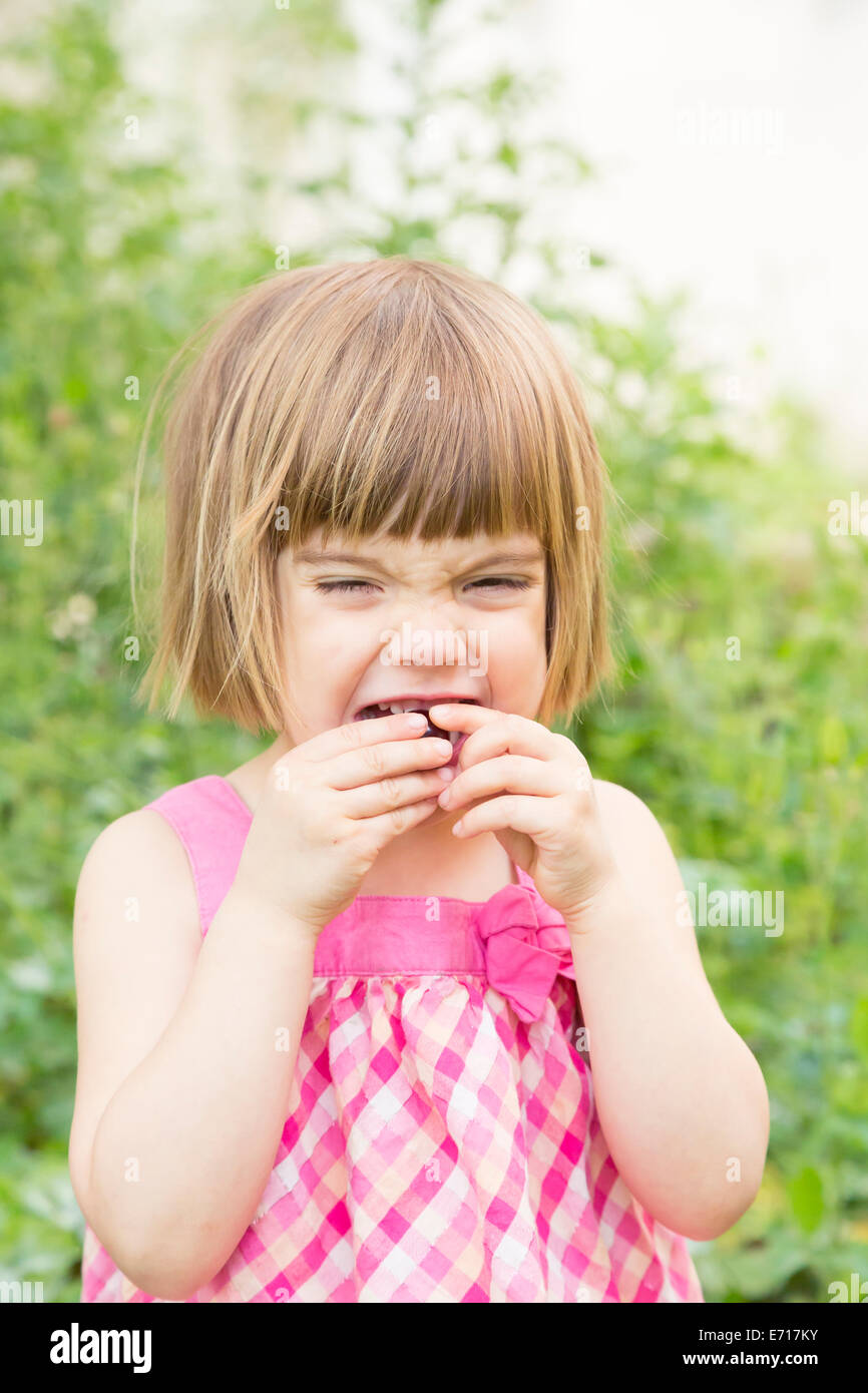 Portrait of little girl eating cherry Stock Photo Alamy