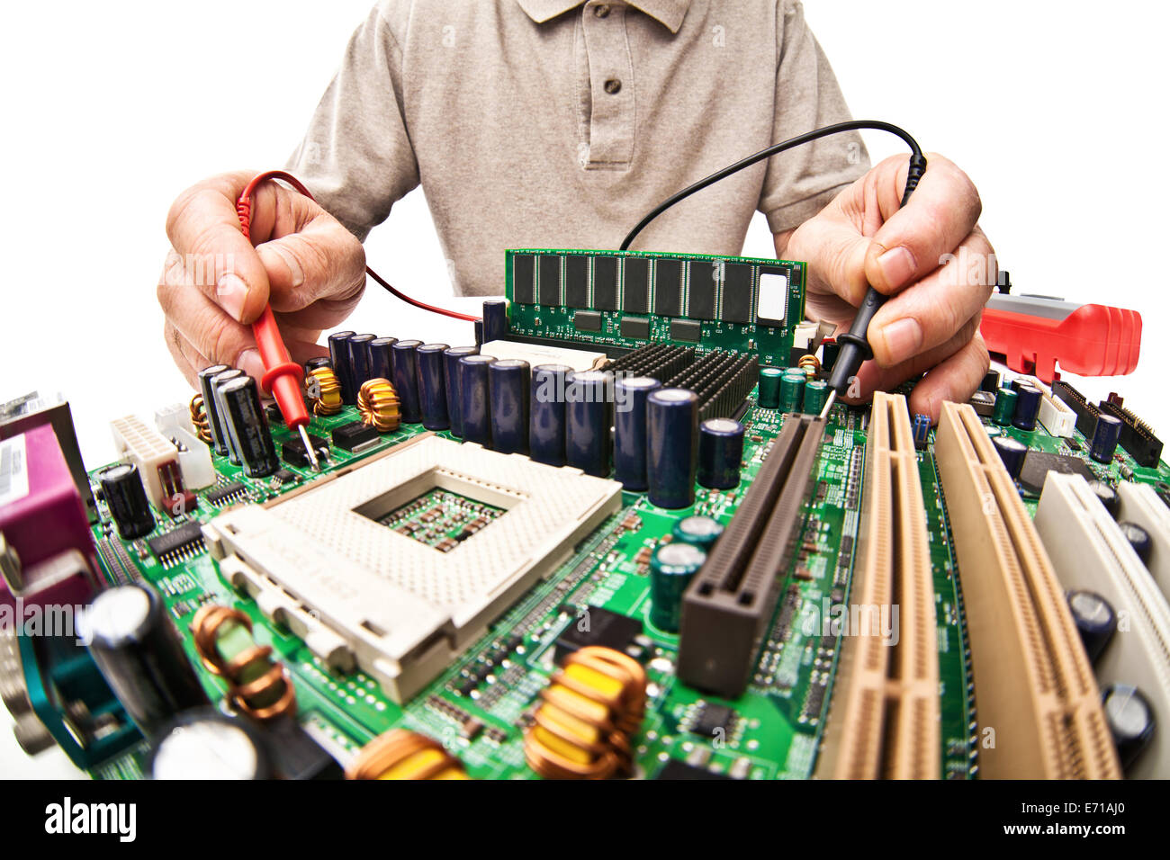 hardware expert work on motherboard isolated Stock Photo