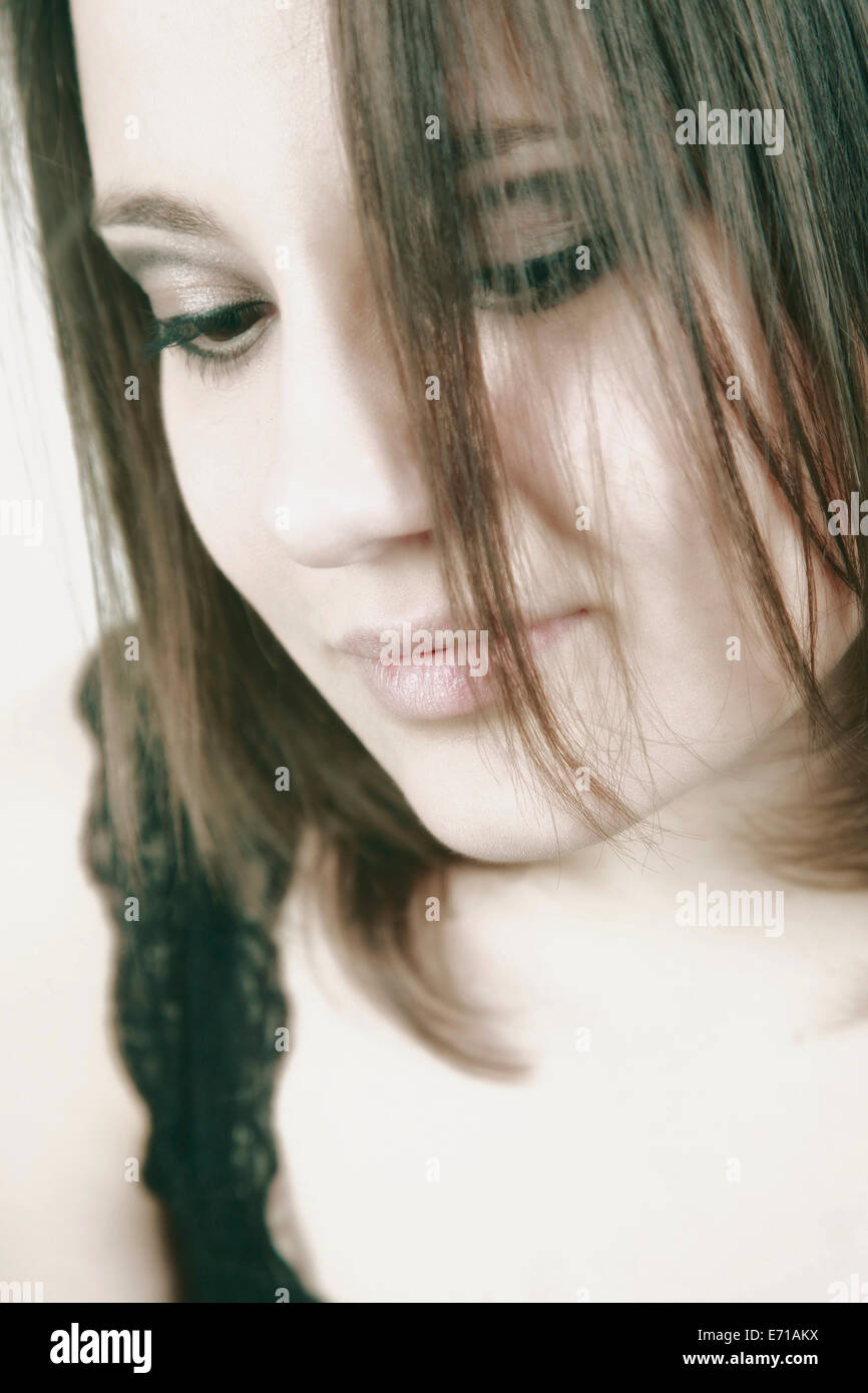 Strand Face Portrait of young woman with strands of her in her face Stock Photo - Alamy