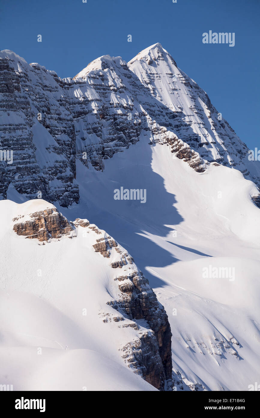 Snowy peak of Canin in the middle of winter covered with a lot off fresh snow. Stock Photo