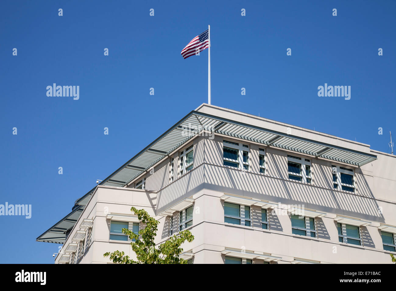 Germany, Berlin, Part of facade of US embassy with American flag Stock Photo