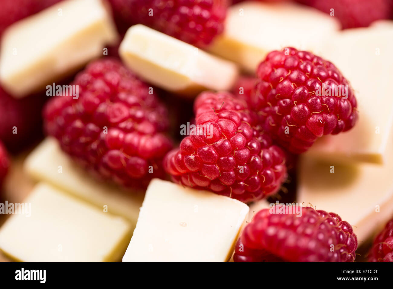 Raspberries and white chocolate close-up Stock Photo - Alamy