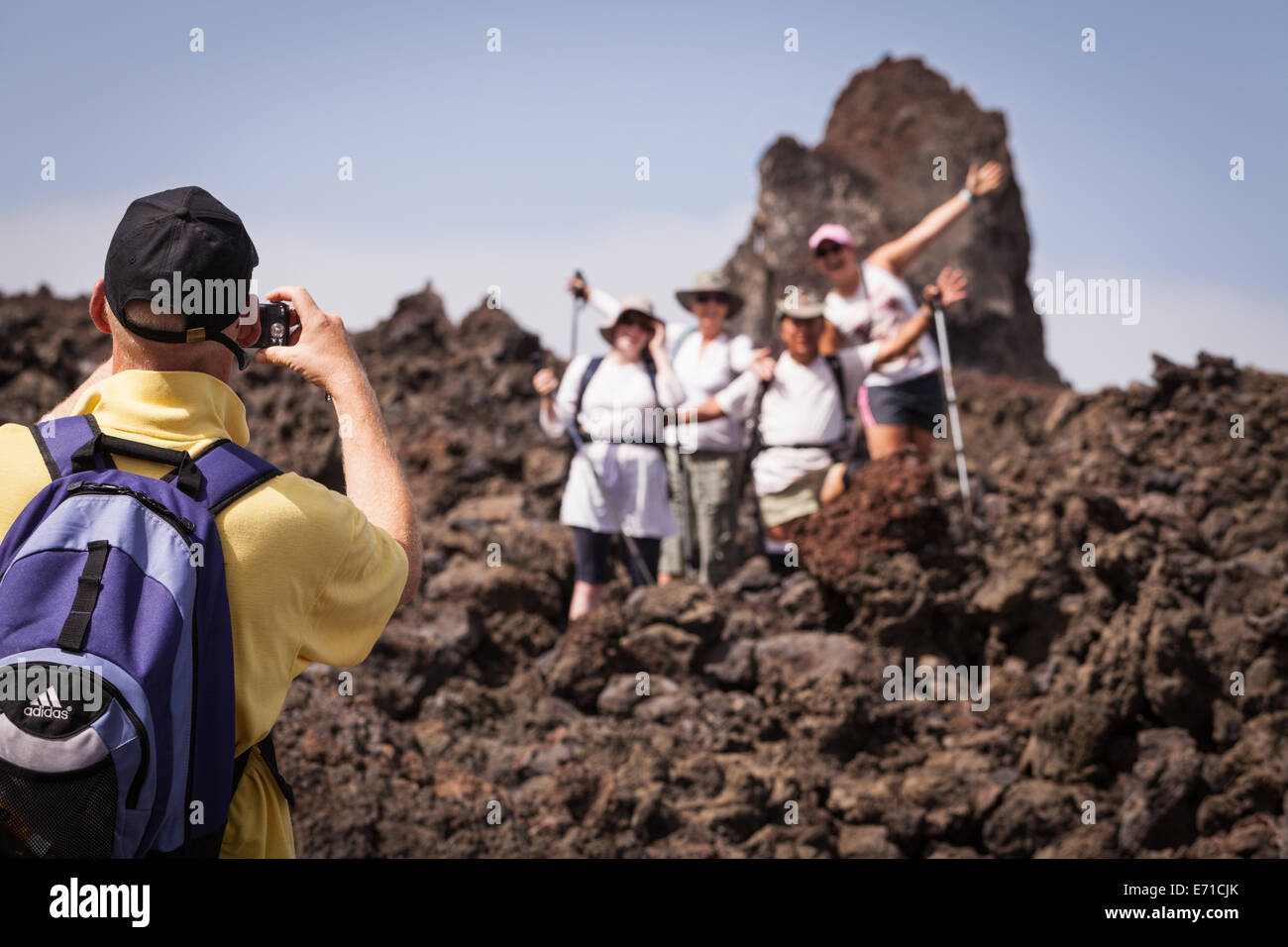 Group photo of walkers on the lava field from the 1909 eruption, Chinyero, Canary Islands, spain. Stock Photo