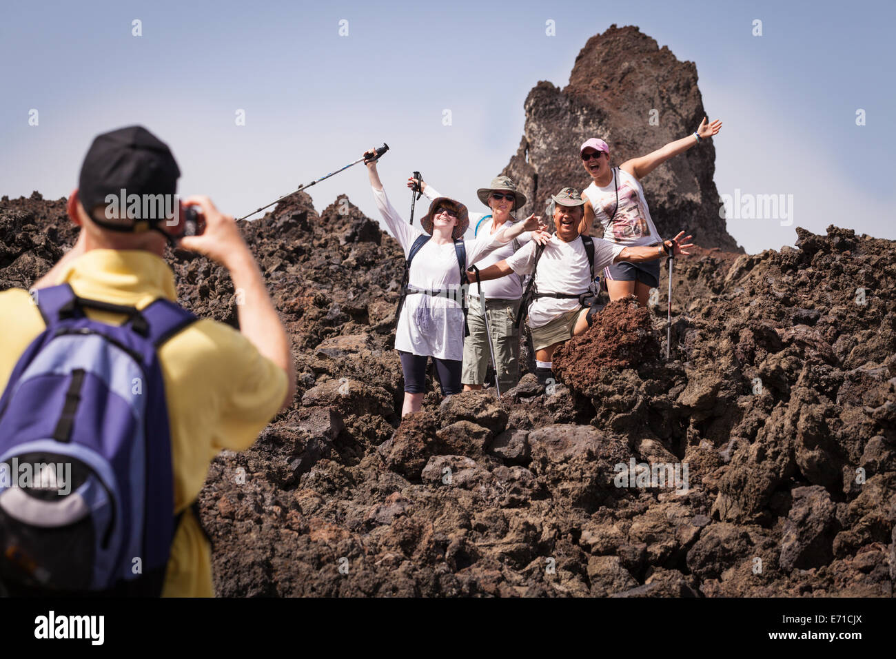 Group photo of walkers on the lava field from the 1909 eruption, Chinyero, Canary Islands, spain. Stock Photo
