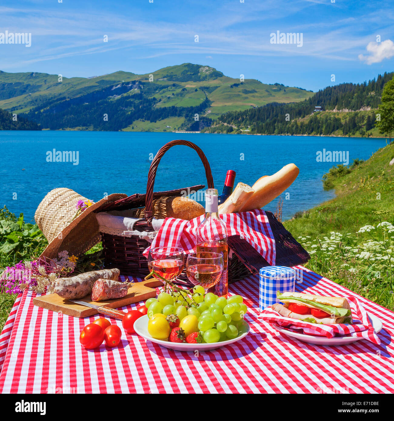 Picnic in alpine mountains with lake on background, panoramic view Stock Photo