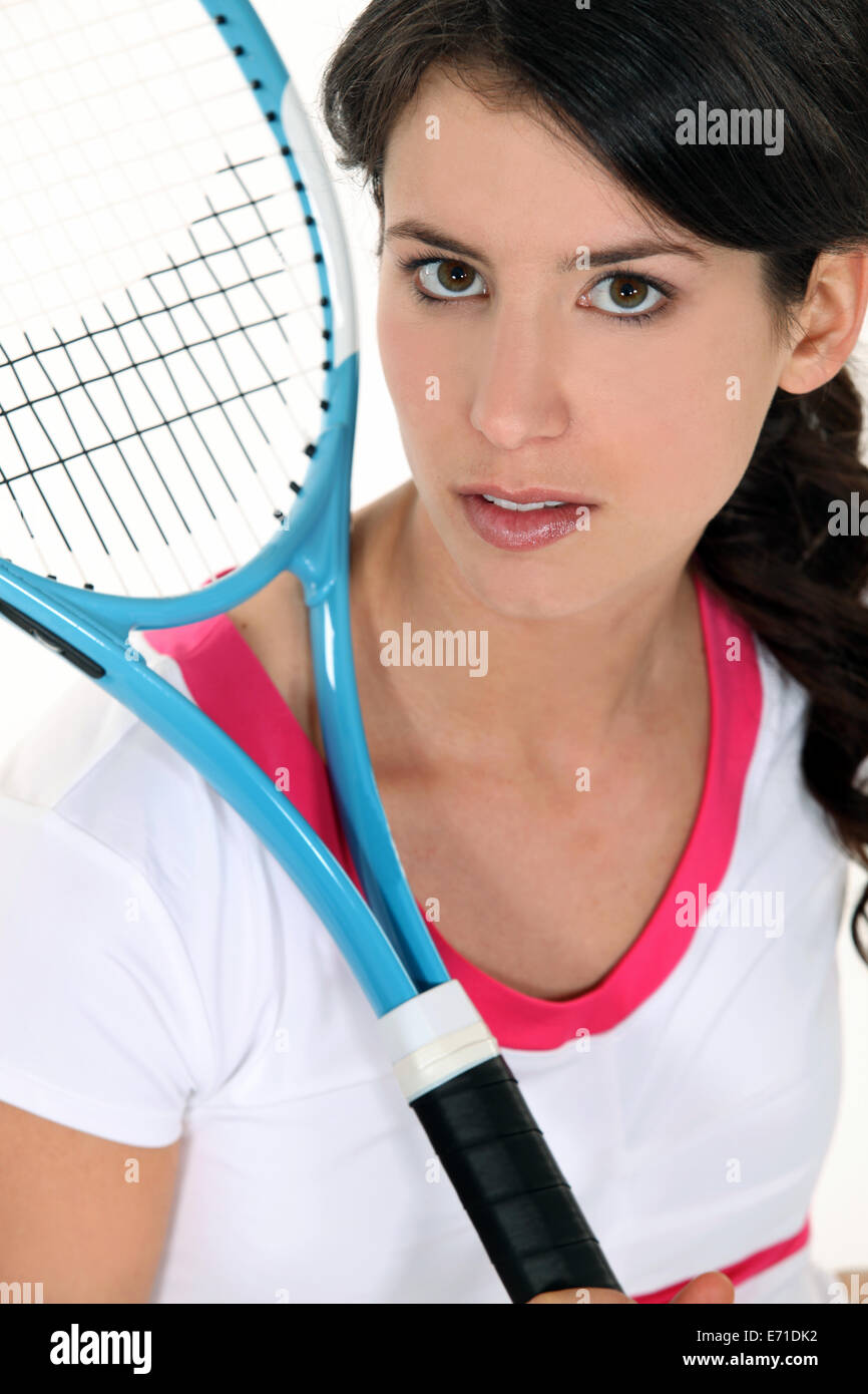 Woman holding a tennis racket Stock Photo