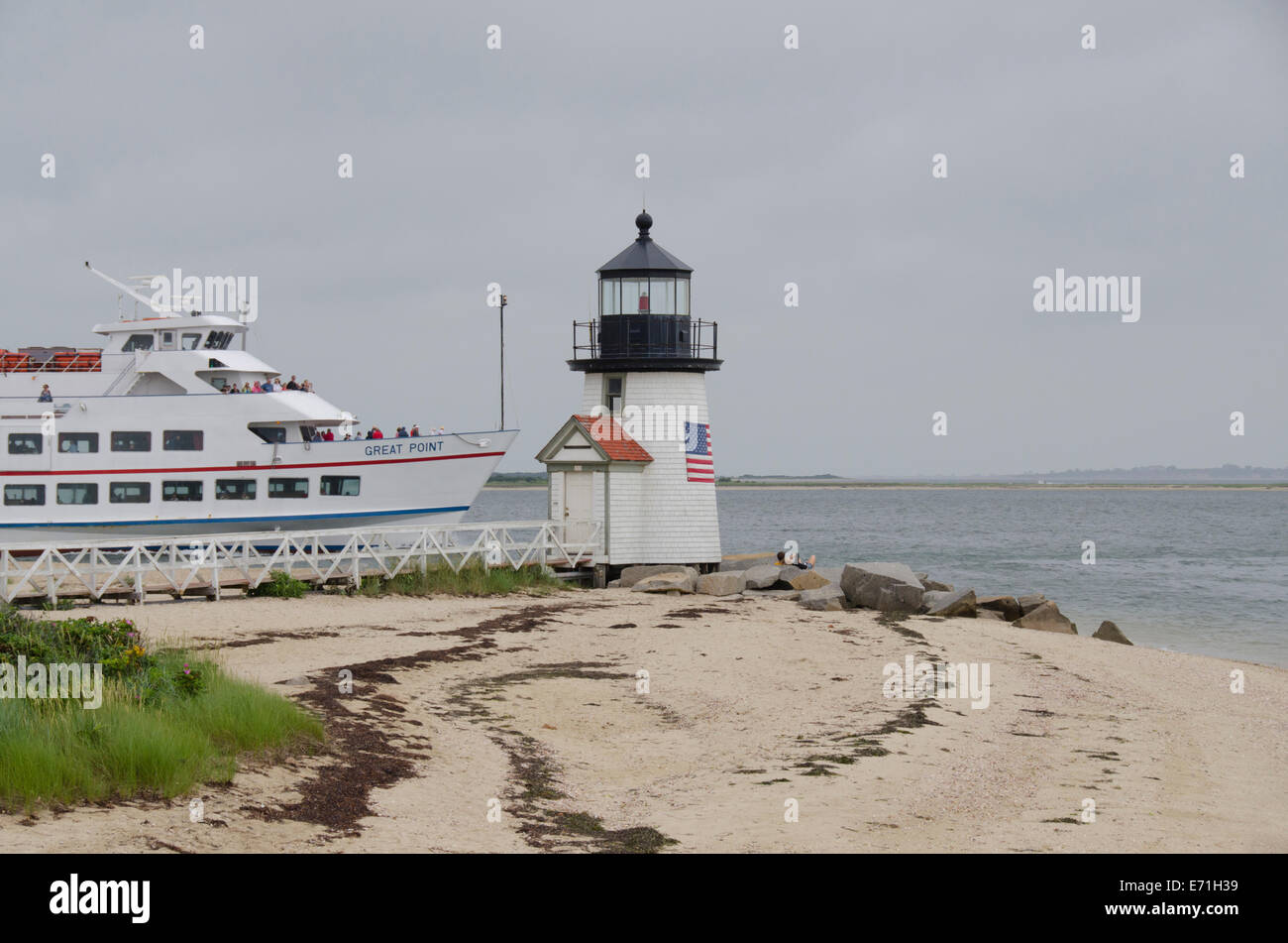 USA, Massachusetts, Nantucket. Brant Point Lighthouse and Hy-Line Great Point Ferry. Stock Photo