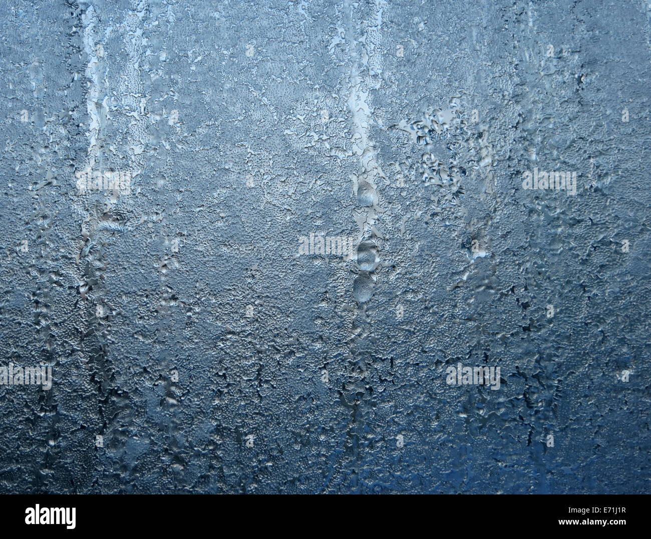 Closeup of section of frozen glass window creating an interesting ice pattern Stock Photo