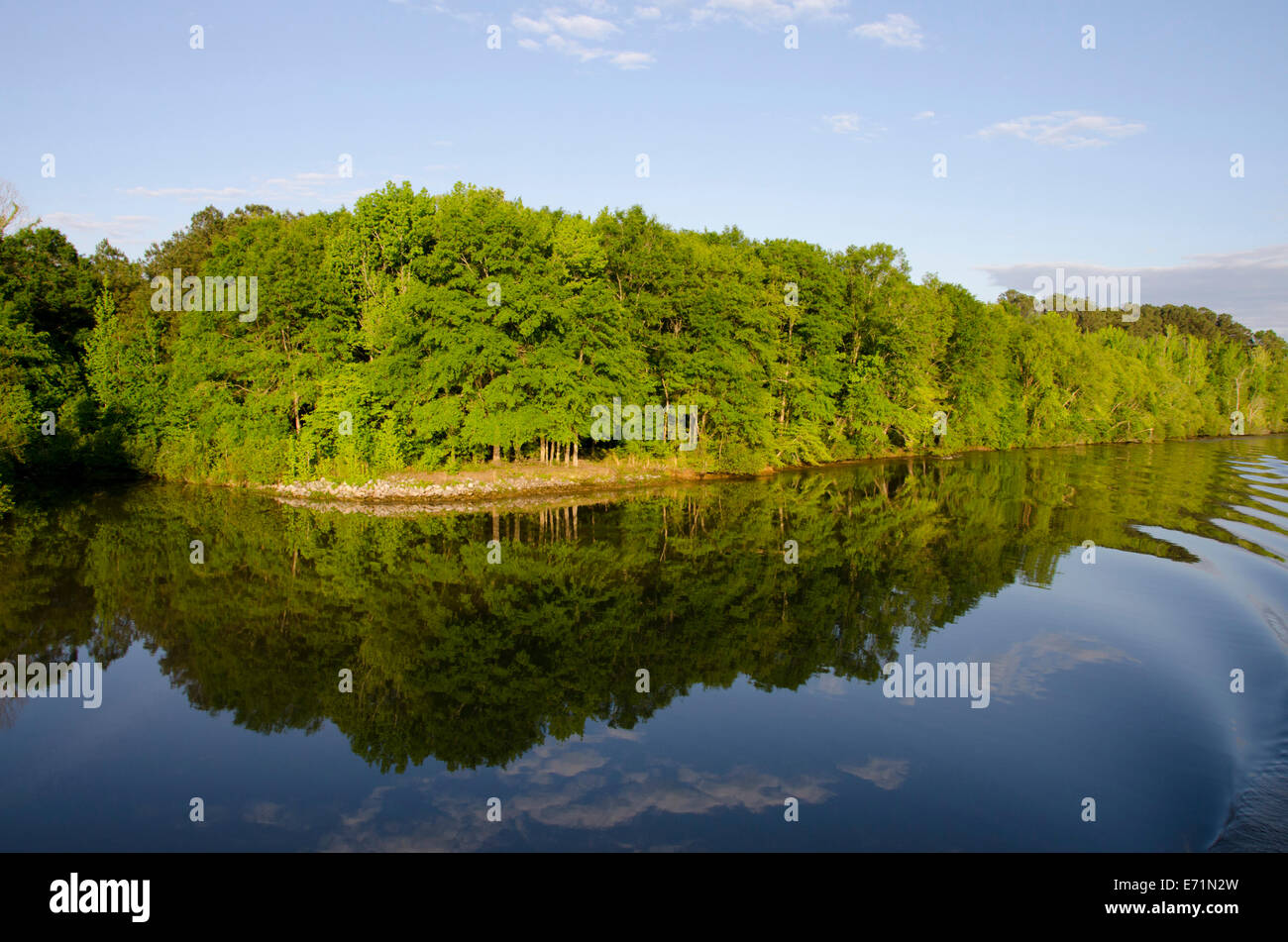 USA, Mississippi, Tennessee-Tombigbee Waterway. Early evening reflection along the Tenn-Tom Waterway. Stock Photo