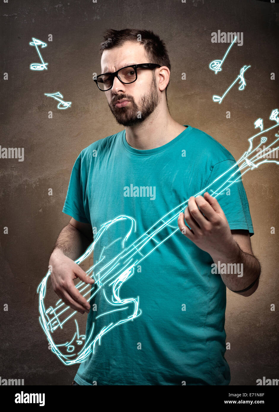 Man with glasses and beard playing imaginary air guitar Stock Photo - Alamy