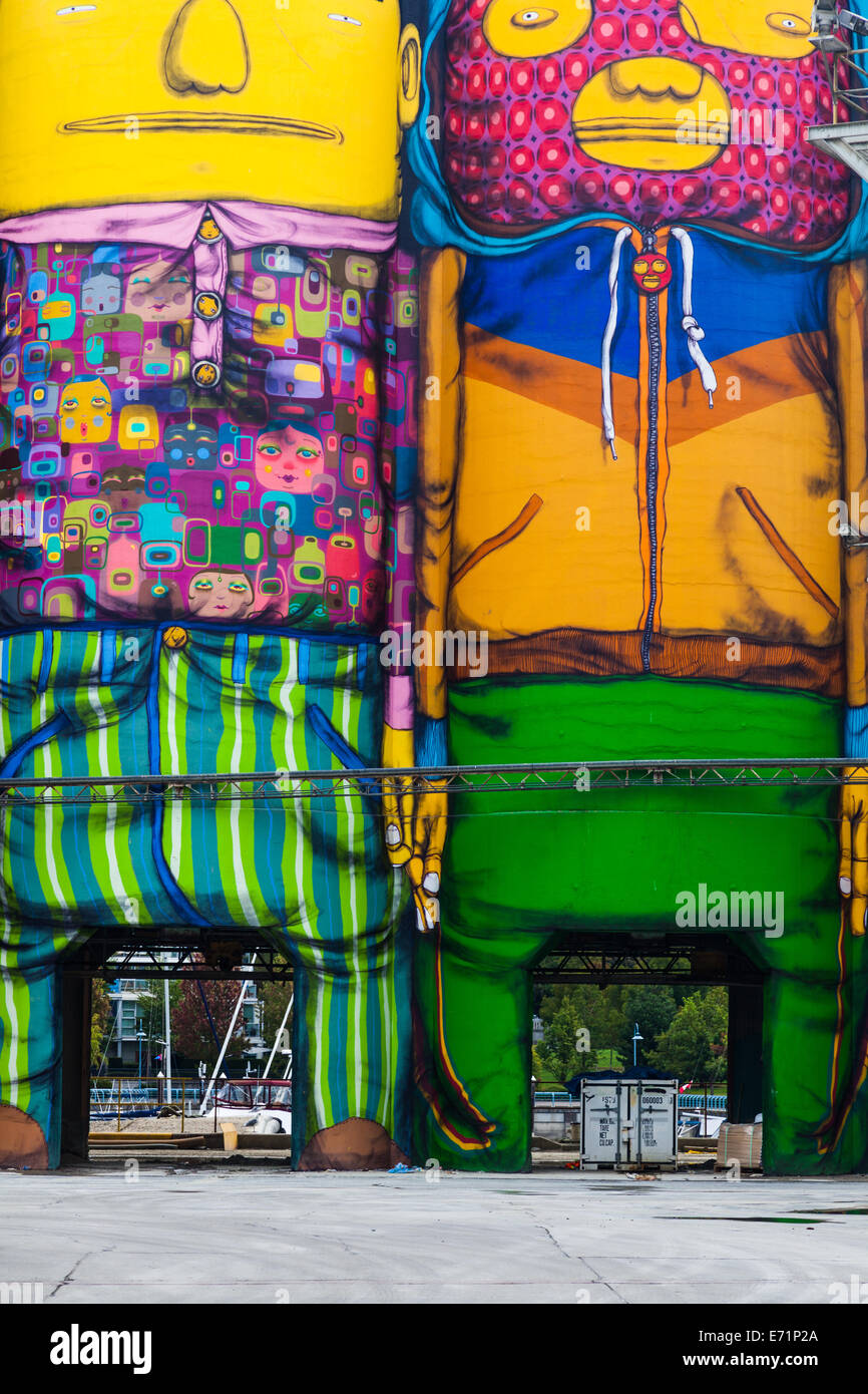 Industrial concrete silos painted with cartoon characters, Granville Island, Vancouver, Canada Stock Photo