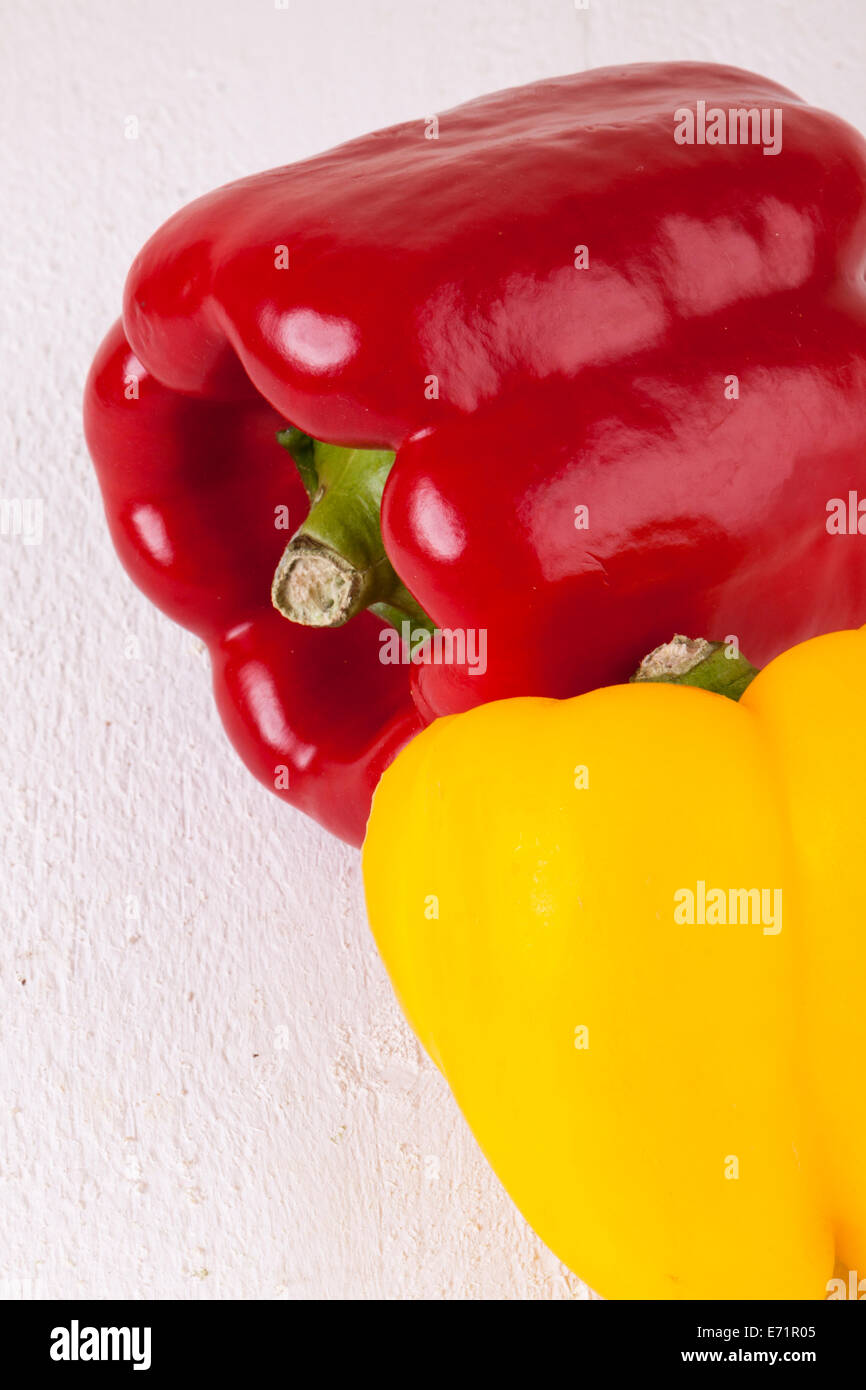 Red and Yellow Peppers on White Wooden Background Stock Photo - Alamy