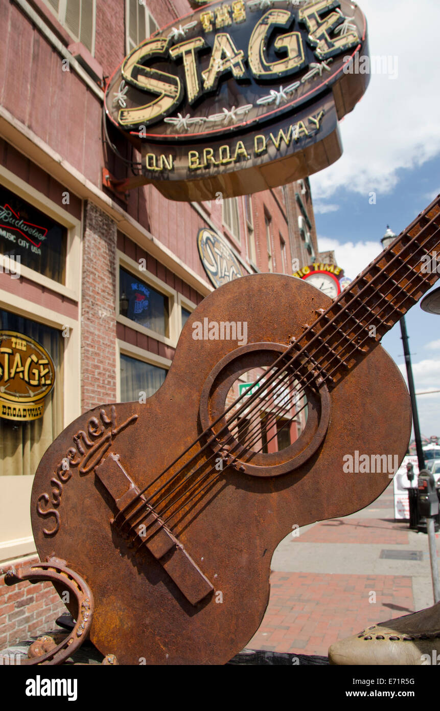 USA, Tennessee, Nashville. The Stage on Broadway sign and guitar