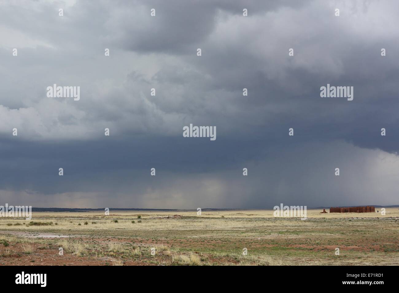 A storm passes over the adobe remnants of Fort Union National Monument. Stock Photo