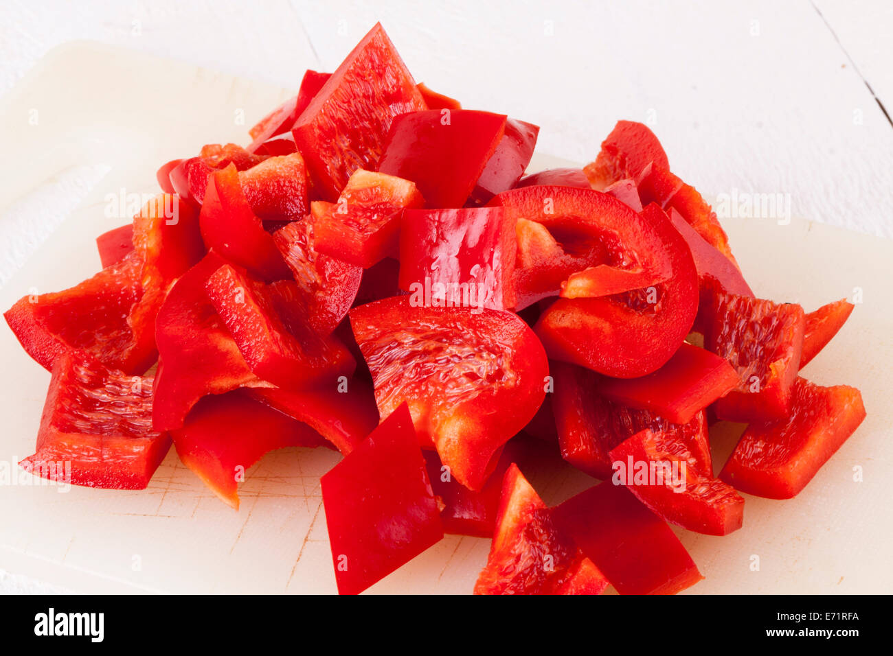 Red and Yellow Peppers on White Wooden Background Stock Photo - Alamy