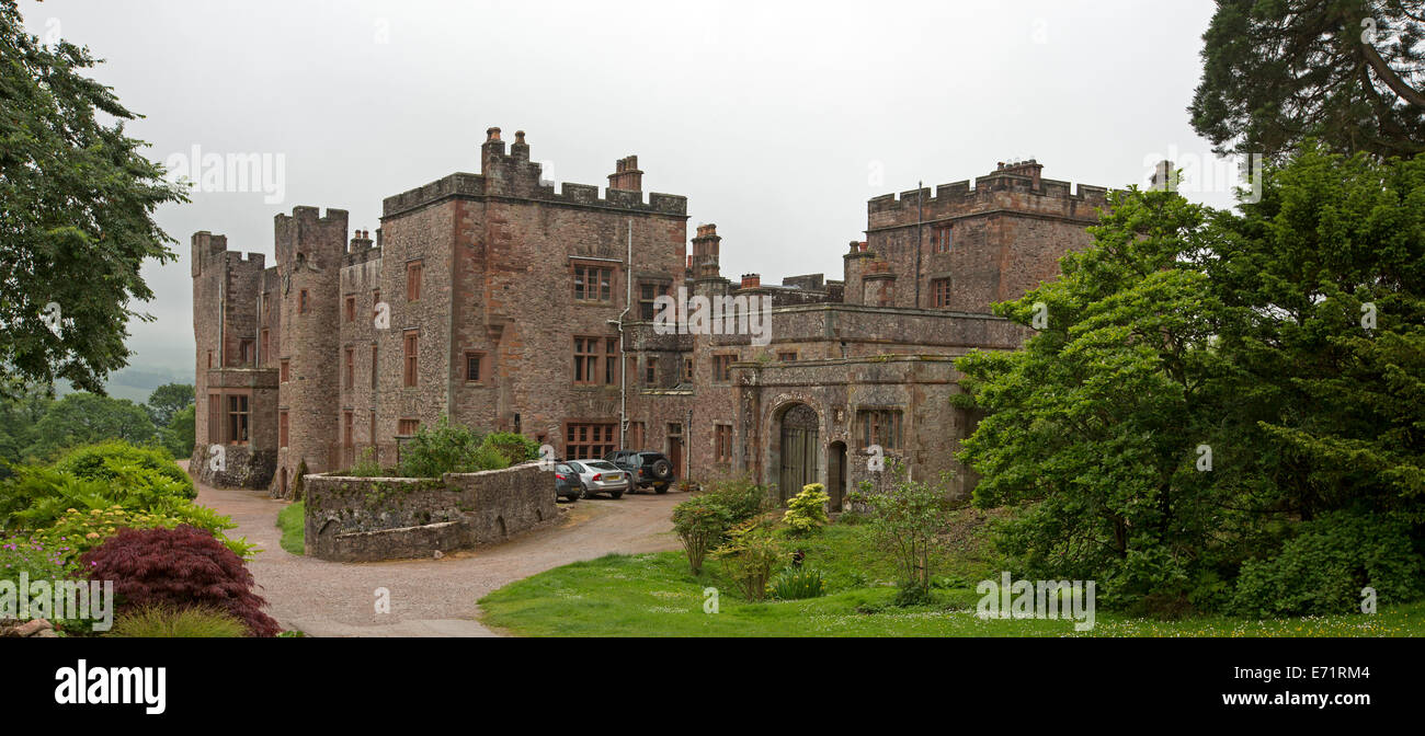 Historic 13th century Muncaster castle, a family home and popular tourist attraction near Ravenglass, Cumbria England Stock Photo