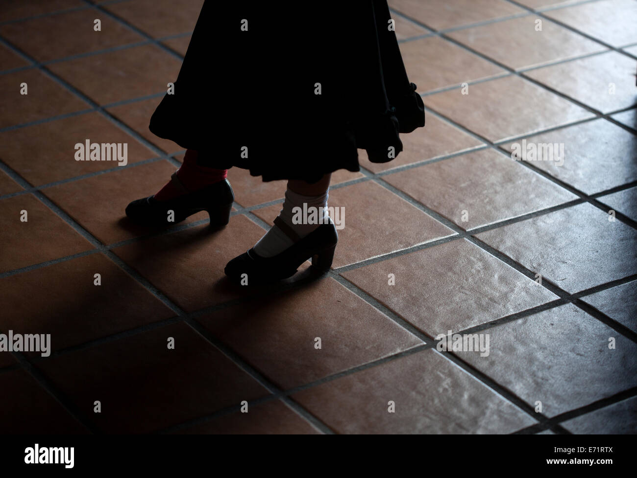 A girl stamps her feet as she practices with the Flamenco Dance group Savia Nueva directed by Olga Nuria in Paterna Stock Photo