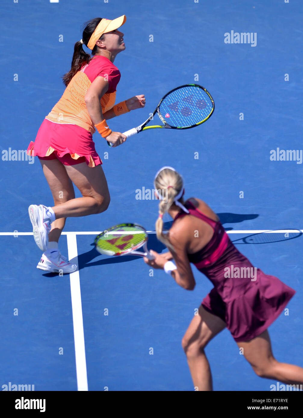 New York, USA. 3rd Sep, 2014. Zheng Jie (L) of China and Andrea Hlavackova of the Czech Republic compete during their women's doubles quarterfinal match against Kimiko Date-Krumm of Japan and Barbora Zahlavova Strcova of the Czech Republic at the 2014 U.S. Open in New York, the United States, Sept. 3, 2014. Date-Krumm and Strcova won 2-1. Credit:  Yin Bogu/Xinhua/Alamy Live News Stock Photo