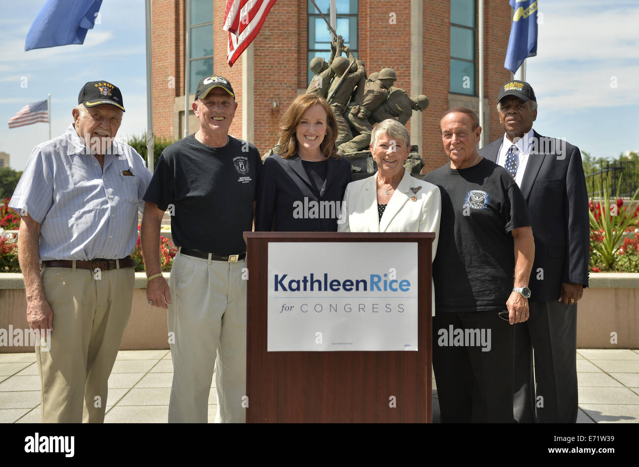 East Meadow, New York, USA. 3rd Sep, 2014. At center, KATHLEEN RICE (in black), Democratic congressional candidate (NY-04), and outgoing Representative CAROLYN MCCARTHY (in white) are at Veterans Memorial at Eisenhower Park, after they toured Northport VA Medical Center. Rice released a whitepaper on veterans policy and announced the formation of her campaign's new Veterans Advisory Committee, and 4 of its members participtated at the press conference: PAUL ZYDOR, (in blue shirt) of Merrick, U.S. Navy, Korean War Veteran; PAT YNGSTROM, (in black T-shirt and cap) of Merrick, U.S. Army Paratro Stock Photo