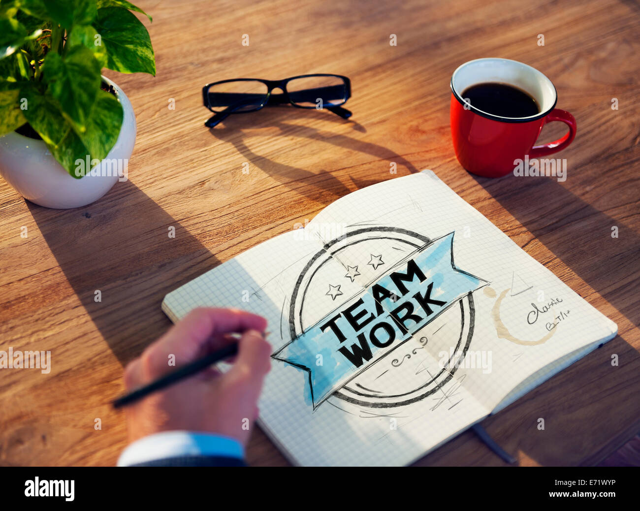 Man with a Note and a Single Word Teamwork Stock Photo