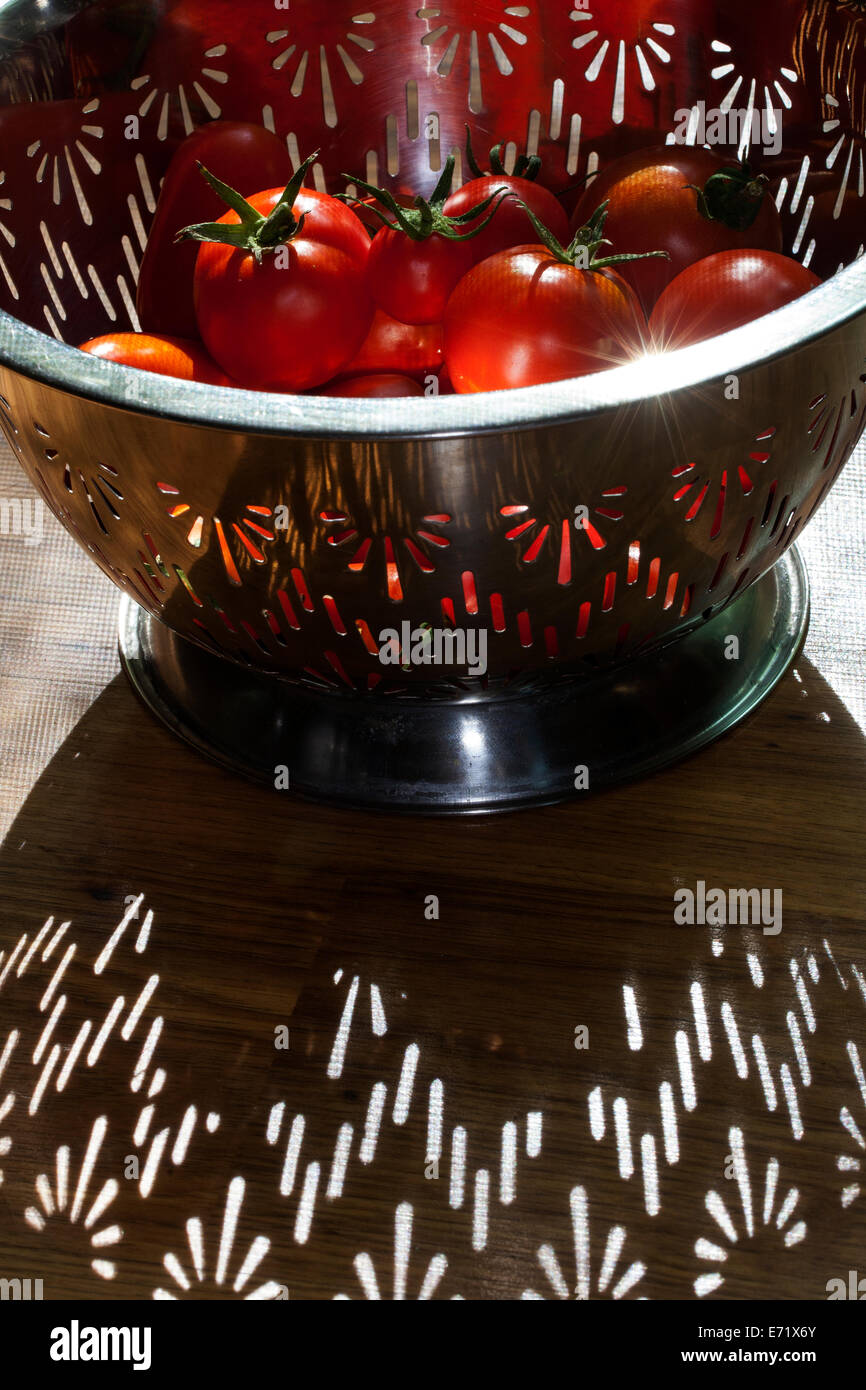 Red tomatoes in a colander, Marin County, California, USA Stock Photo