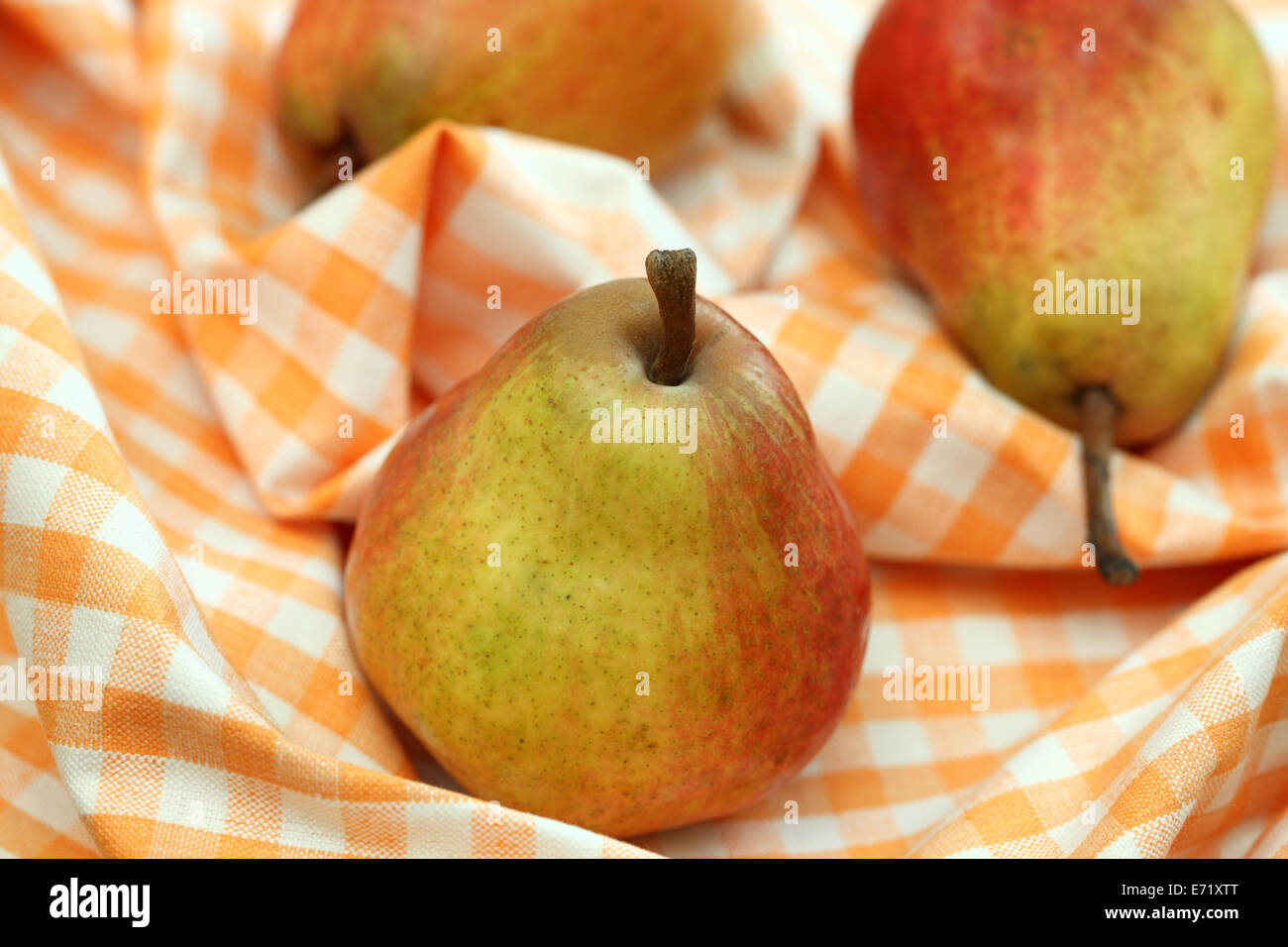 Pears on a dish towel. Closeup. Stock Photo