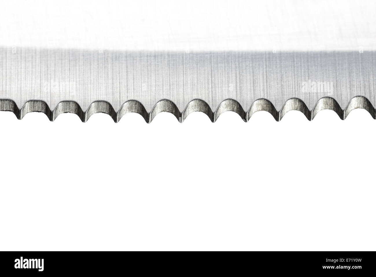 Macro of the blade of a stainless steak knife with sharp teeth Stock Photo