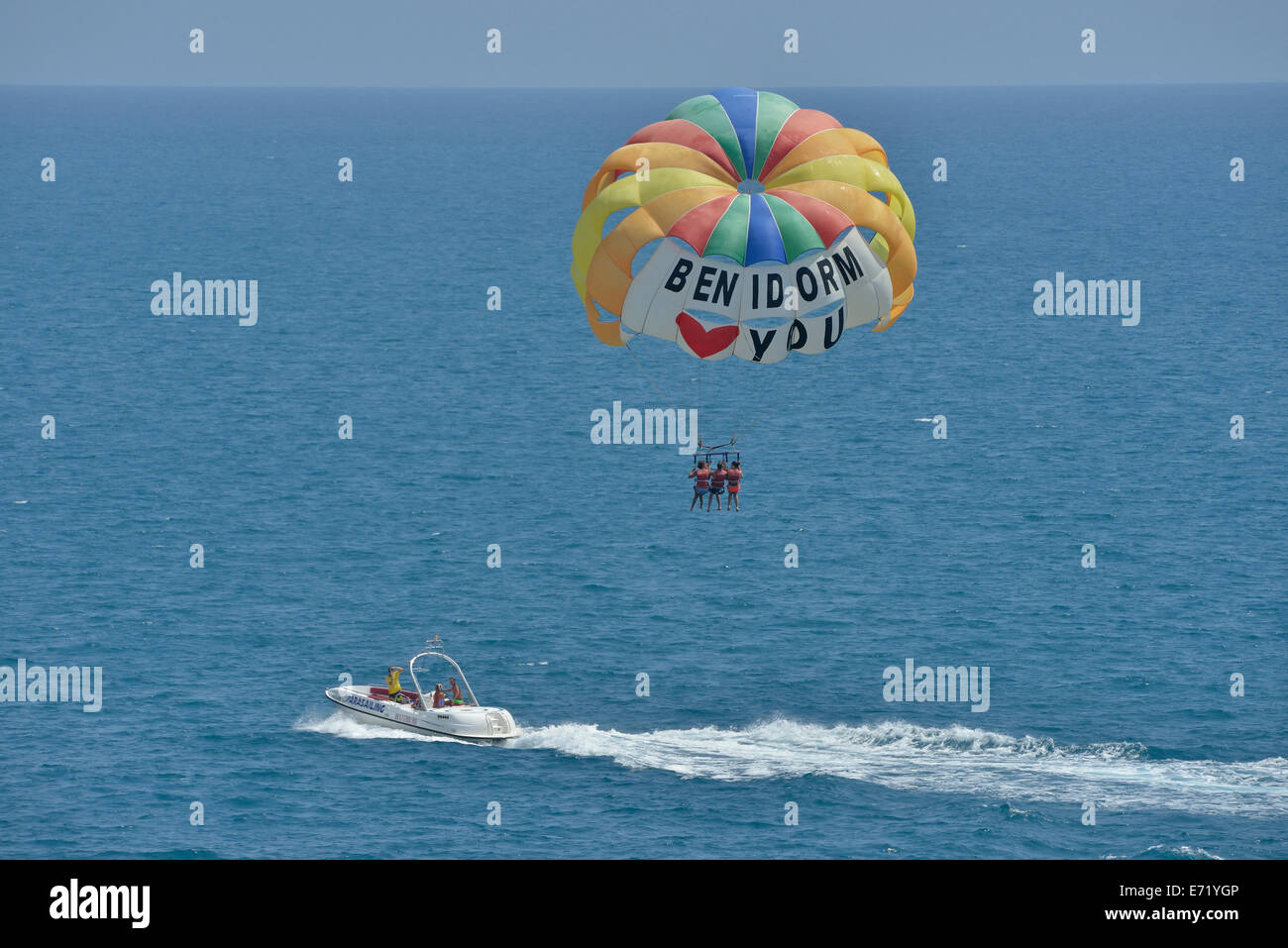 Excursion boat with paraglider, labeled &quot;Benidorm loves you&quot;, Playa Levante, Benidorm, Costa Blanca, Spain Stock Photo